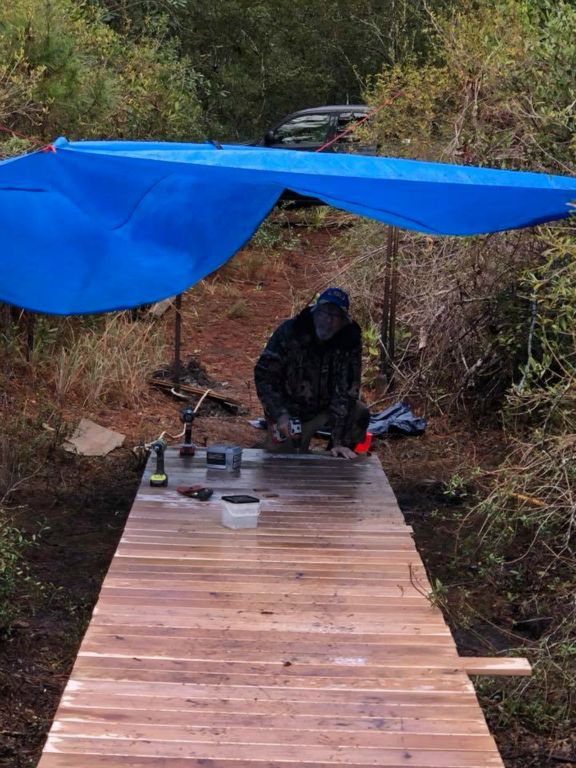 Hays attaching deckboards in the rain
