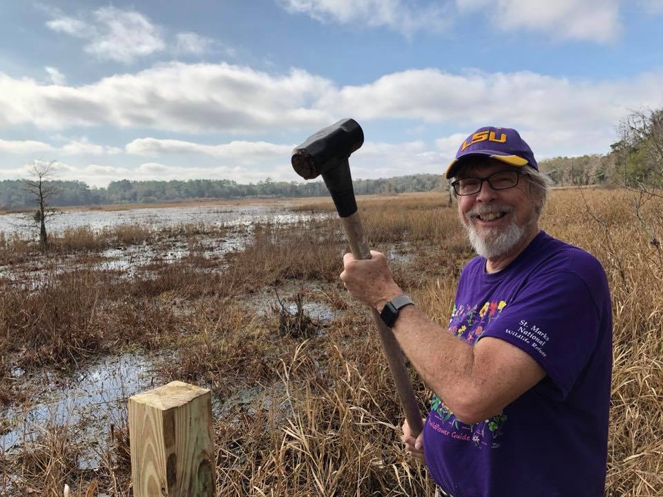 Hays pounding in the 4 by 4 corner posts