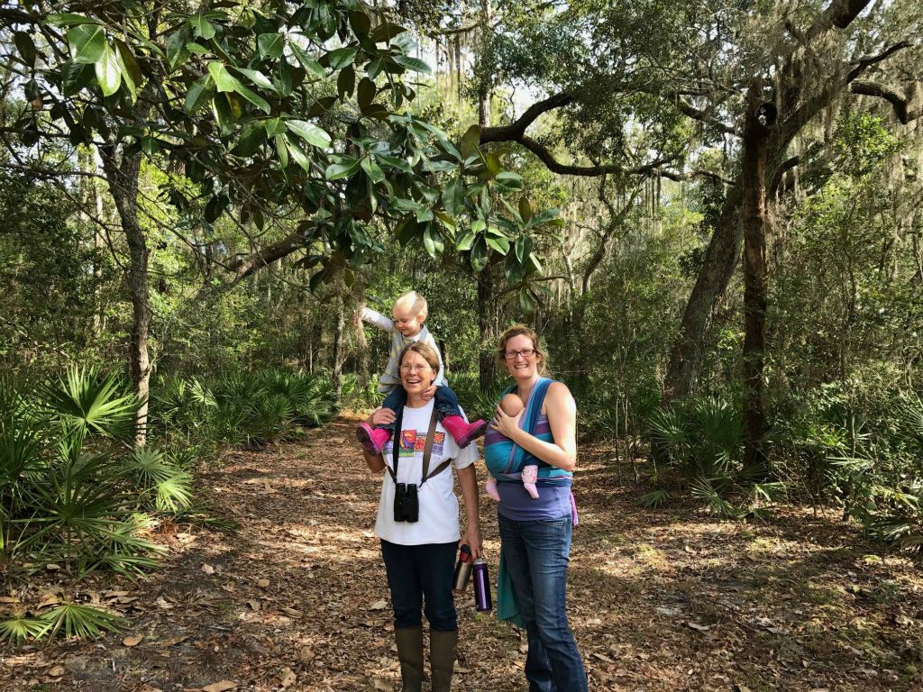Donna, granddaughter Evie on her shoulders and Holly McCollum with granddaughter Noelle taking a hike in January 2017.