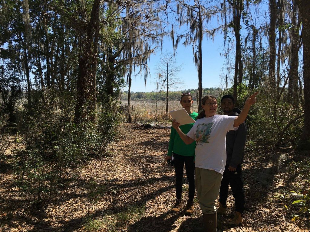 Donna McCollum showing Jocelynne Ann and Taylor the homesite, March 2016