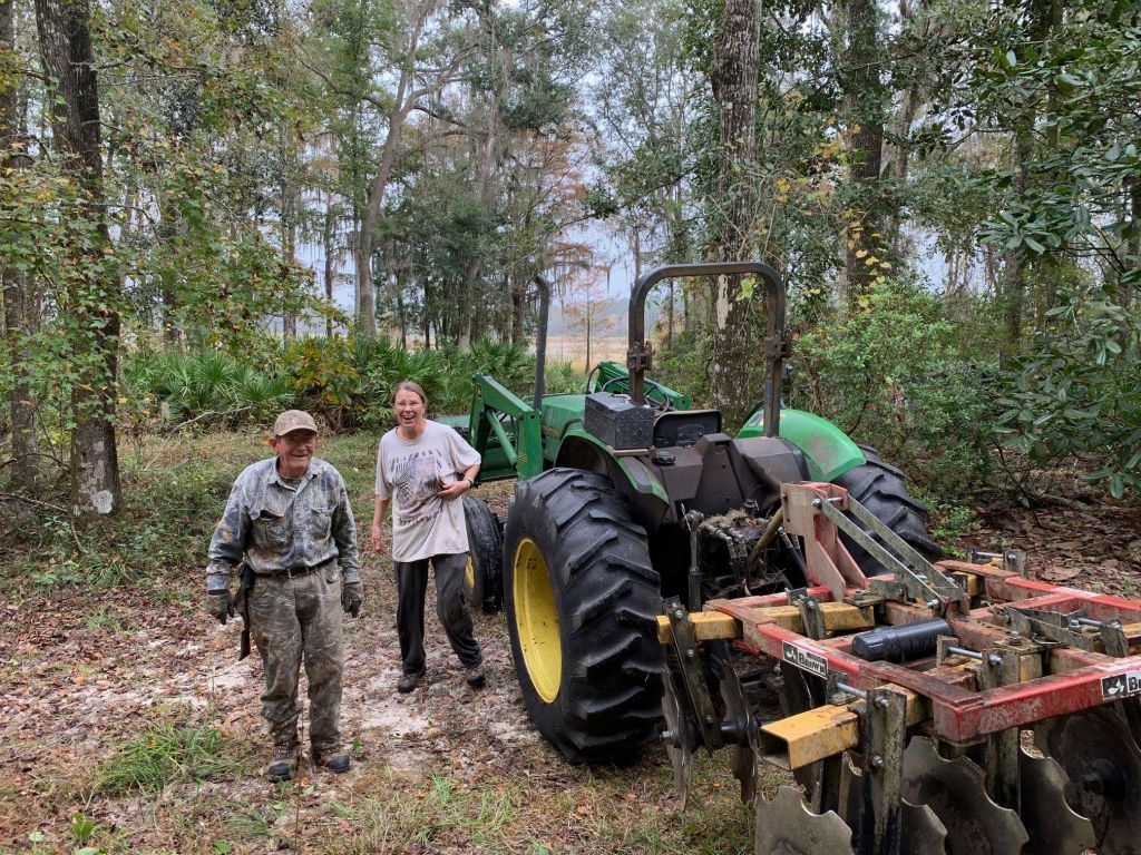Tommy and Donna McCollum getting ready to take down a dead tree that looked like it might fall on the barn!